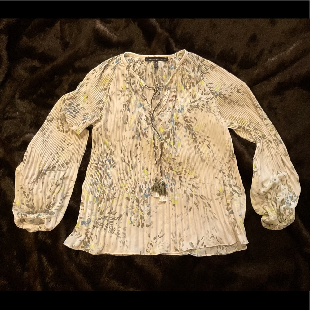 WHBM Size S Flowing top. Multi colored with a cream background.